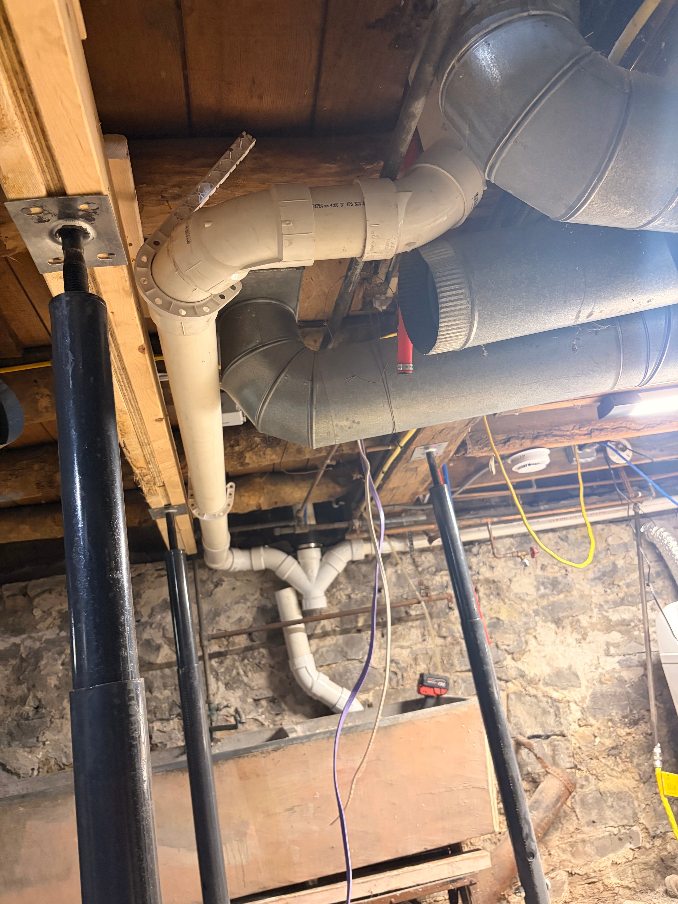 PVC drain and vent rough-in plumbing work — Buffalo NY basement